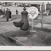 Water trough and Y.M.C.A. (Young Mens Christian Association) welcome sign in square in center of town. Columbus, Georgia.