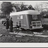 Trailers for sale with construction worker and his wife as possible prospective buyers, along main highway from Alexandria to Camp Beauregard, Louisiana.