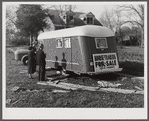 Trailers for sale with construction worker and his wife as possible prospective buyers, along main highway from Alexandria to Camp Beauregard, Louisiana.