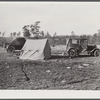 Tent, car, and farm truck. Used for sleeping and general housing by construction workers off highway near Camp Claiborne. They cook out of doors and have not sanitary conveniences. Alexandria, Louisiana.