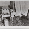 Tent, car, and farm truck, used for sleeping and general housing by construction workers off highway near Camp Claiborne, Louisiana. Cook out of doors and have no sanitary conveniences.