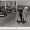 Construction workers waiting on highway in Alexandria to catch rides to Camp Livingston job. Louisiana.