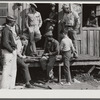 Migratory laborers playing checkers in front of juke joint during slack season for vegetable pickers. Belle Glade, Florida.