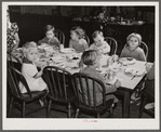 Children of migratory workers eating lunch in twenty-four hour nursery at Osceola migratory labor camp built by FSA (Farm Security Administration). Belle Glade, Florida.