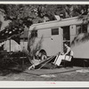 Guests of Sarasota trailer park outside their trailer home. Sarasota, Florida.