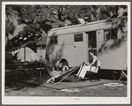 Guests of Sarasota trailer park outside their trailer home. Sarasota, Florida.