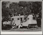 Relaxing outside their trailer home, Sarasota trailer park, Sarasota, Florida.