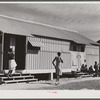 Metal shelters for agricultural workers in Okeechobee migratory labor camp. Belle Glade, Florida.