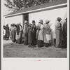 Migratory workers waiting to receive supplies of surplus commodities. Belle Glade, Florida.