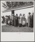 Migratory workers waiting to receive supplies of surplus commodities. Belle Glade, Florida.