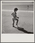 Daughter of parents living at Sarasota trailer park, Sarasota, Florida, playing in the water at the beach.