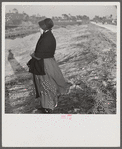 Amish farm woman from Pennsylvania near Sarasota, Florida, observing Florida farming methods.