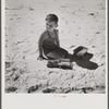 Son of parents who live at Sarasota trailer park, Sarasota, Florida, playing on the beach.