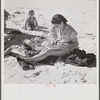 Guest of Sarasota trailer park, Sarasota, Florida, at the beach with her family.