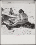 Guest of Sarasota trailer park, Sarasota, Florida, at the beach with her family.