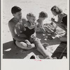 Guest of Sarasota trailer park, Sarasota, Florida, with his family, picnicking at the beach.