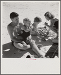 Guest of Sarasota trailer park, Sarasota, Florida, with his family, picnicking at the beach.