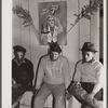 Spanish muskrat trappers waiting in dance hall during fur auction sale. Delacroix Island, Louisiana.