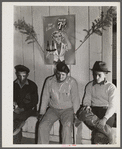 Spanish muskrat trappers waiting in dance hall during fur auction sale. Delacroix Island, Louisiana.