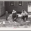 Fastening the stock with corrugated staples. Screen door construction. Charles County, La Plata, Maryland.