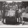 Home supervisor while making home visit to FSA (Farm Security Administration) borrower inspects water supply for repair. Charles County near La Plata, Maryland.