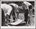 Galvanized sheet steel of 24 gauge is used as corner reinforcement. Screen door construction demonstration. Charles County, La Plata, Maryland.