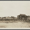 View of buildings at shore. Sign on building reads "Long Island Oyster Farms Inc." Greenport, Southold