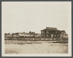 View of buildings at shore. Sign on building reads "Long Island Oyster Farms Inc." Greenport, Southold