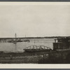 View of Greenport Harbor, from a point near railroad depot, showing boats and Shelter Island in the distance. Greenport, Southold