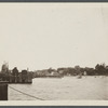 View of Greenport Harbor from ferry, showing wharves and houses on shore. Greenport, Southold