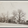 House on the left owned by Jeremiah Mulford (1858), center house owned by Laura Halleck (1924), house on right owned by Gwen Bennett (1924) and a gift shop. East side of Main St., south of David's Lane. East Hampton, East Hampton