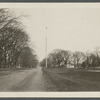 Flagpole (came from Oregon). Erected in 1899 (250th Anniversary of town). House on right of flagpole is Sam Miller's. East side Main St., north side of Dunemere Lane. East Hampton, East Hampton