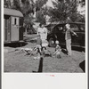 Children and their mother outside their trailer home. Sarasota trailer park, Sarasota, Florida.