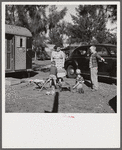 Children and their mother outside their trailer home. Sarasota trailer park, Sarasota, Florida.