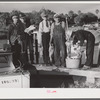 Guests of Sarasota trailer park, Sarasota, Florida, with fish they had just caught.