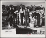 Guests of Sarasota trailer park, Sarasota, Florida, with fish they had just caught.