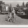 Children playing outside their trailer home at Sarasota trailer park. Sarasota, Florida.