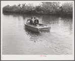 Three FSA (Farm Security Administration) supervisors going out the bayous and marshes to some of the muskrat trappers at their camps. Near Delacroix Island, Louisiana.