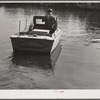 FSA (Farm Security Administration) supervisor going out in the bayous and marshes to visit some of the muskrat trappers at their canps. Near Delacroix Island, Louisiana.