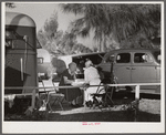 Guests of trailer park playing Chinese checkers outside their trailer home. Sarasota trailer park, Sarasota, Florida.