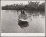 Three FSA (Farm Security Administration) supervisors going out in the bayous and marshes to visit some of the muskrat trappers at their camp. Near Delacroix Island, Louisiana. See general caption number one.