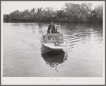 Three FSA (Farm Security Administration) supervisors going out in the bayous and marshes to visit some of the muskrat trappers at their camp. Near Delacroix Island, Louisiana. See general caption number one.