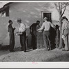 Migratory workers waiting to receive surplus commodities. Belle Glade, Florida.