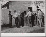 Migratory workers waiting to receive surplus commodities. Belle Glade, Florida.