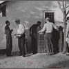 Migratory workers waiting to receive surplus commodities. Belle Glade, Florida.