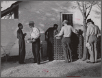 Migratory workers waiting to receive surplus commodities. Belle Glade, Florida.