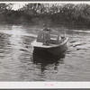 Weldon P. Smith, FSA (Farm Security Administration) supervisor, going out to the bayous and marshes to visit some of the muskrat trappers at their camps. Near Delacroix Island, Louisiana. See general caption number one.
