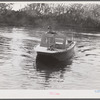 Weldon P. Smith, FSA (Farm Security Administration) supervisor, going out to the bayous and marshes to visit some of the muskrat trappers at their camps. Near Delacroix Island, Louisiana. See general caption number one.