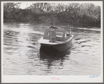 Weldon P. Smith, FSA (Farm Security Administration) supervisor, going out to the bayous and marshes to visit some of the muskrat trappers at their camps. Near Delacroix Island, Louisiana. See general caption number one.