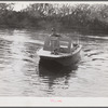 Weldon P. Smith, FSA (Farm Security Administration) supervisor, going out to the bayous and marshes to visit some of the muskrat trappers at their camps. Near Delacroix Island, Louisiana. See general caption number one.